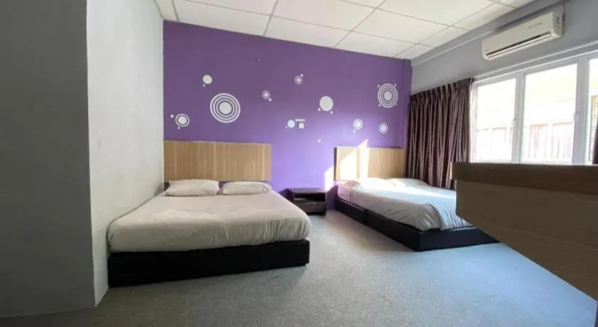 Bed in OYO 89760 Harmoni Inn Hotel