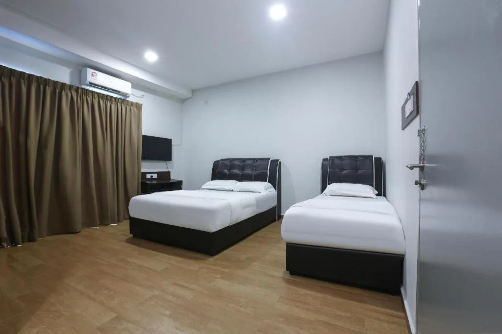 Bed in OYO 89859 PP Traveller's Hotel