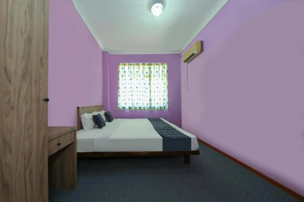 Bed in Capital O 89876 Safari Hotel