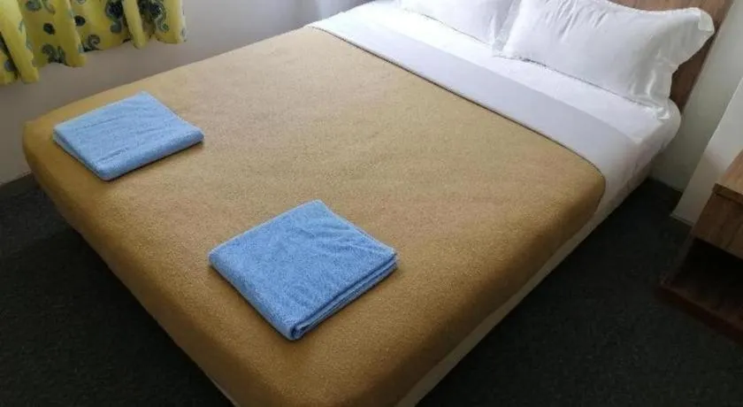 Bed in Capital O 89876 Safari Hotel