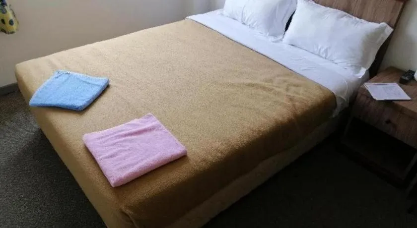 Bed in Capital O 89876 Safari Hotel