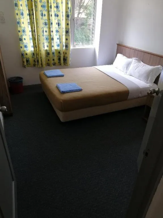 Bed in Capital O 89876 Safari Hotel