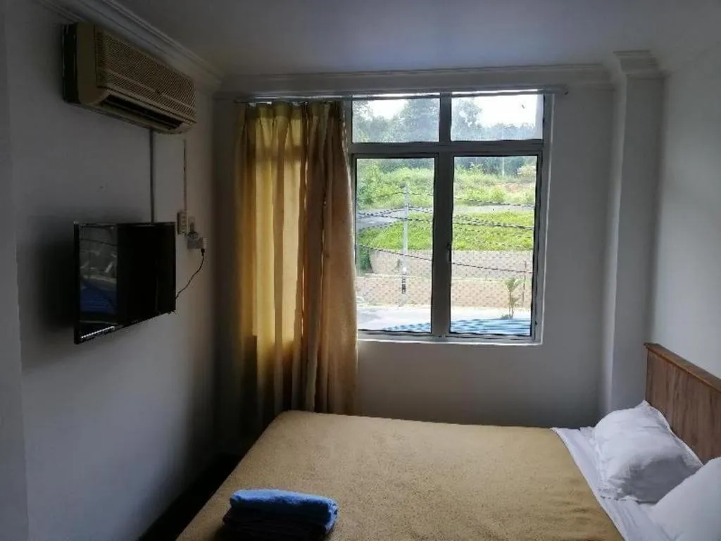 Bed in Capital O 89876 Safari Hotel