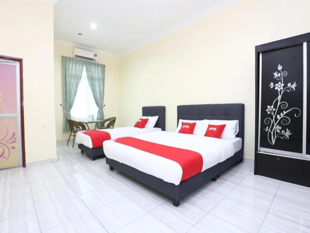 Bed in OYO 89607 Aloha Chalet