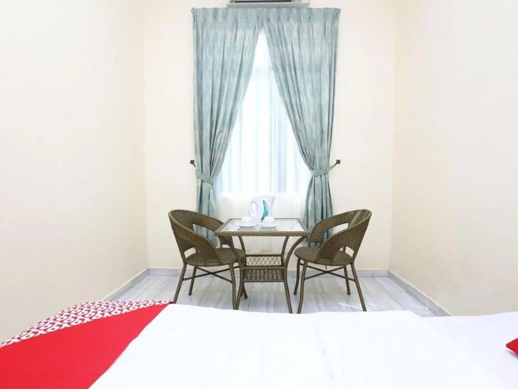 Bed in OYO 89607 Aloha Chalet