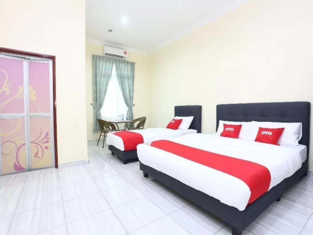 Bed in OYO 89607 Aloha Chalet