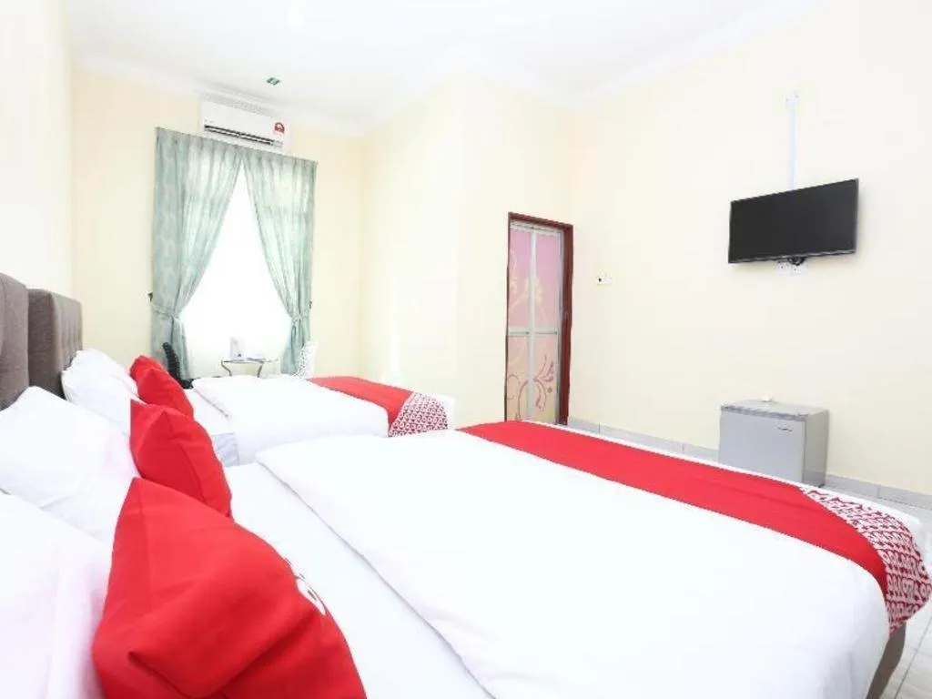 Bed in OYO 89607 Aloha Chalet