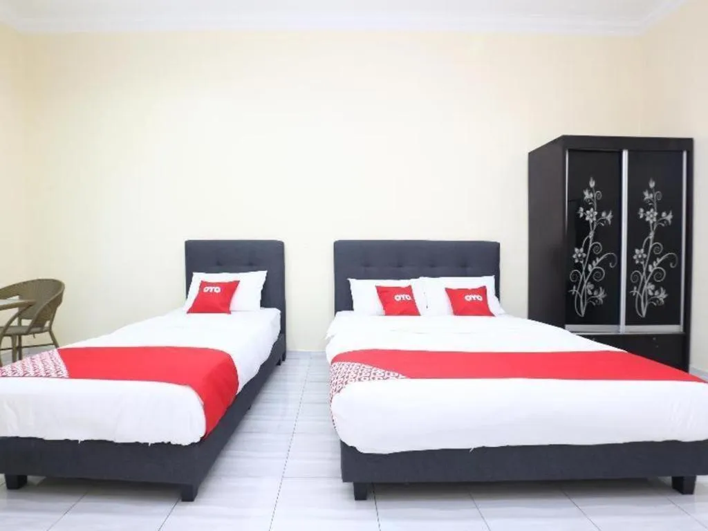 Bed in OYO 89607 Aloha Chalet