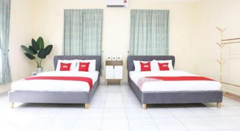 Bed in OYO 89607 Aloha Chalet