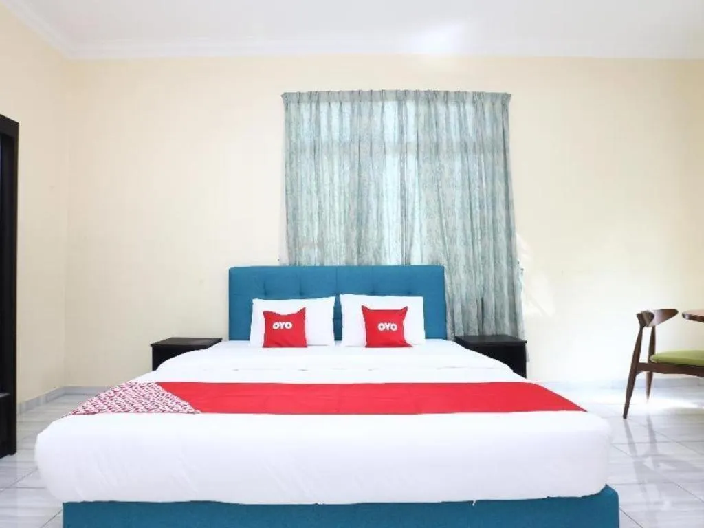 Bed in OYO 89607 Aloha Chalet