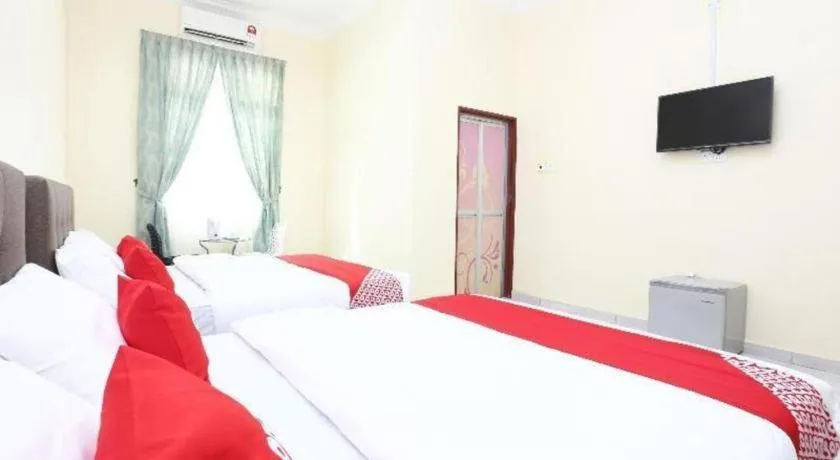 Bed in OYO 89607 Aloha Chalet