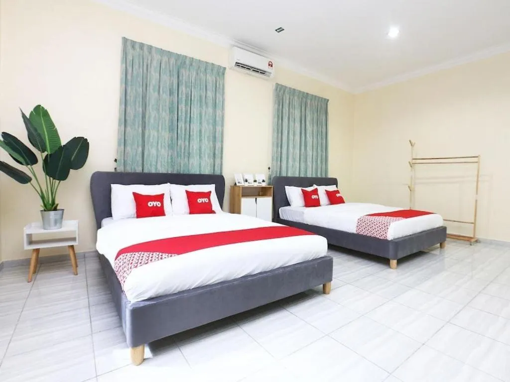 Bed in OYO 89607 Aloha Chalet