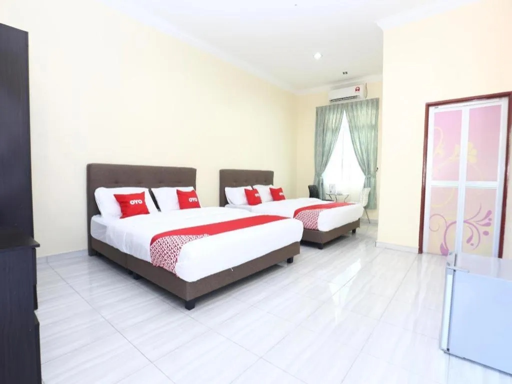 Bed in OYO 89607 Aloha Chalet