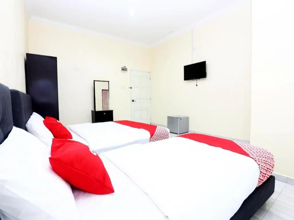 Bed in OYO 89607 Aloha Chalet