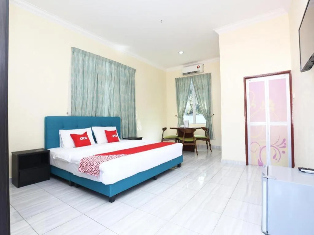 Bed in OYO 89607 Aloha Chalet