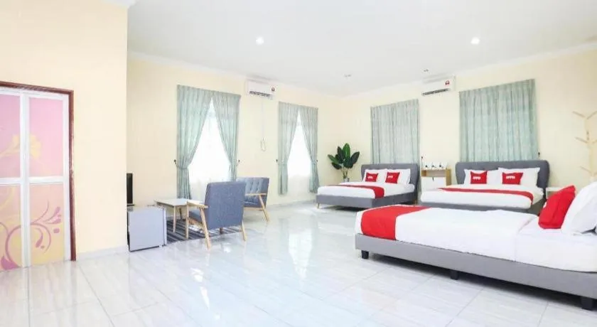 Bed in OYO 89607 Aloha Chalet