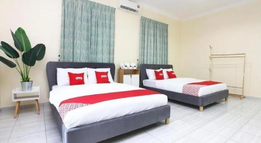 Bed in OYO 89607 Aloha Chalet