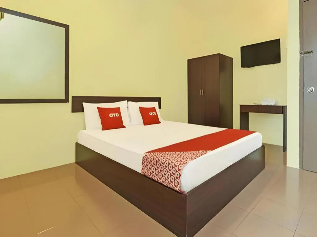 Bed in SPOT ON 91178 Motel Impian