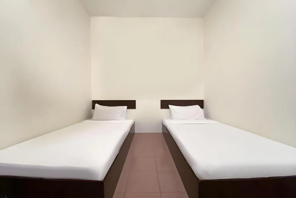 Bed in SPOT ON 91178 Motel Impian