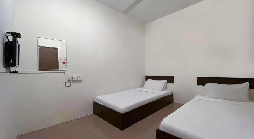 Bed in SPOT ON 91178 Motel Impian