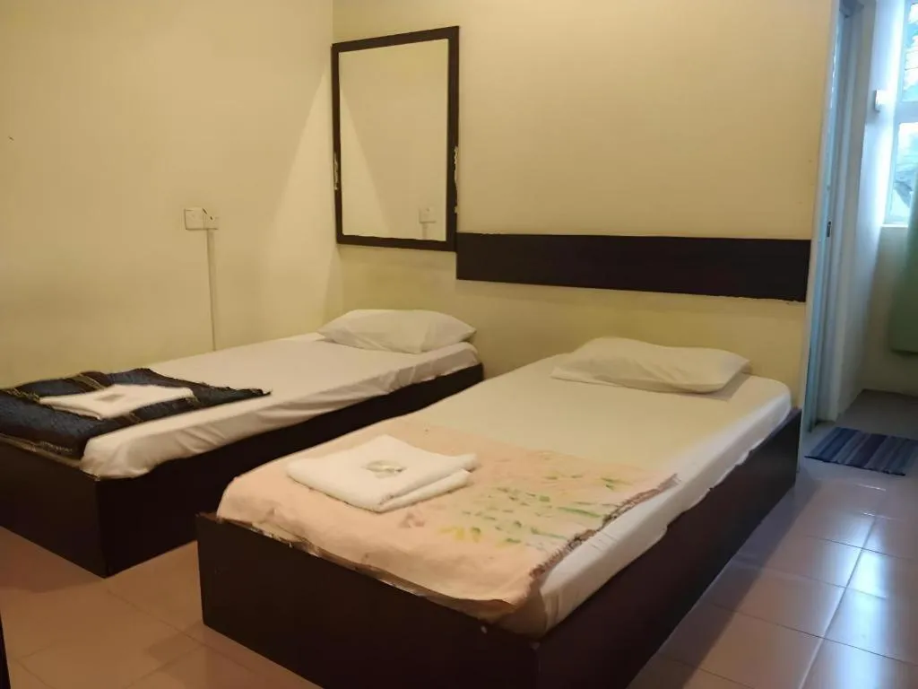 Bed in SPOT ON 91178 Motel Impian