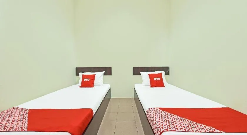 Bed in SPOT ON 91178 Motel Impian