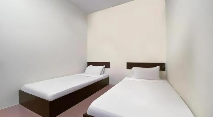 Bed in SPOT ON 91178 Motel Impian