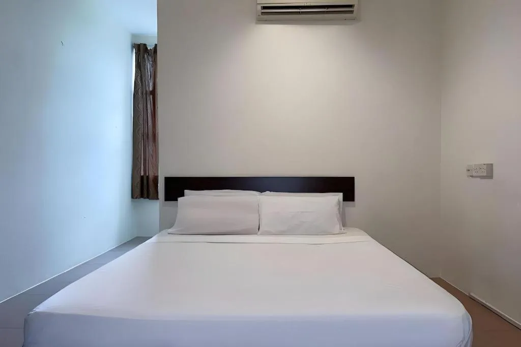 Bed in SPOT ON 91178 Motel Impian