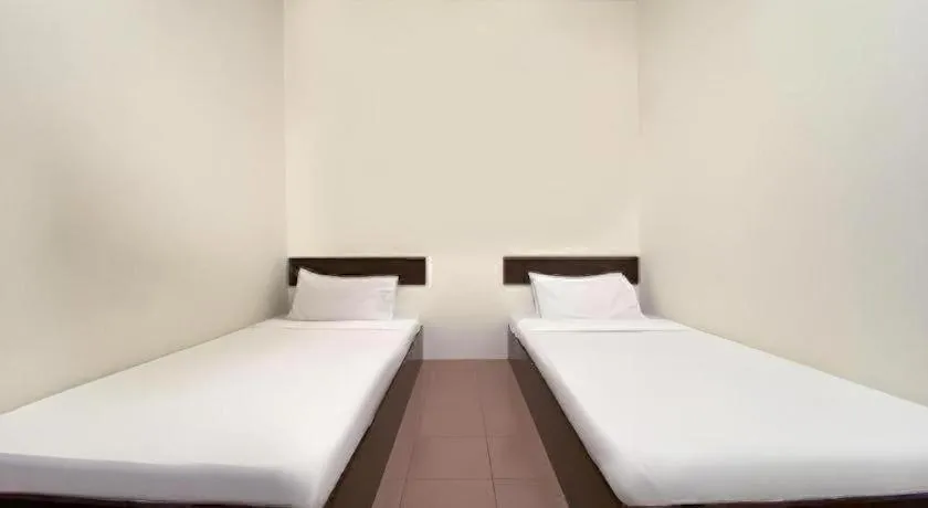 Bed in SPOT ON 91178 Motel Impian