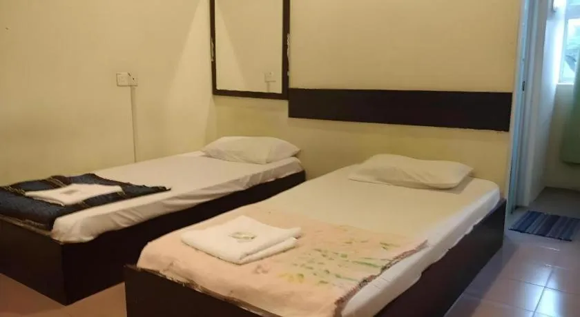 Bed in SPOT ON 91178 Motel Impian