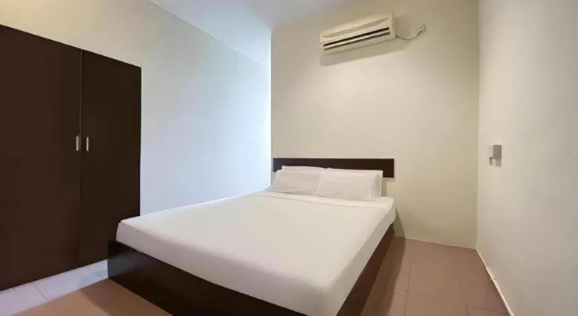 Bed in SPOT ON 91178 Motel Impian