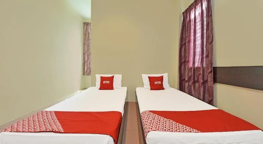 Bed in SPOT ON 91178 Motel Impian