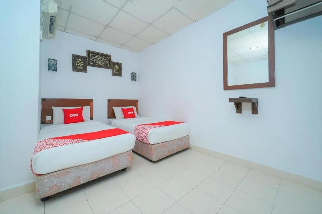 Bed in OYO 89850 Mutiara Motel