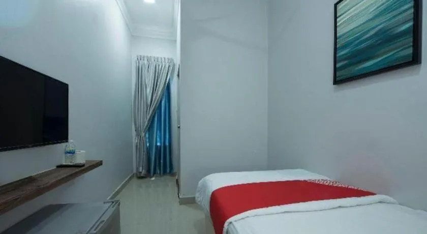 Bed in OYO 90234 Sungai Rengit City Resort 2