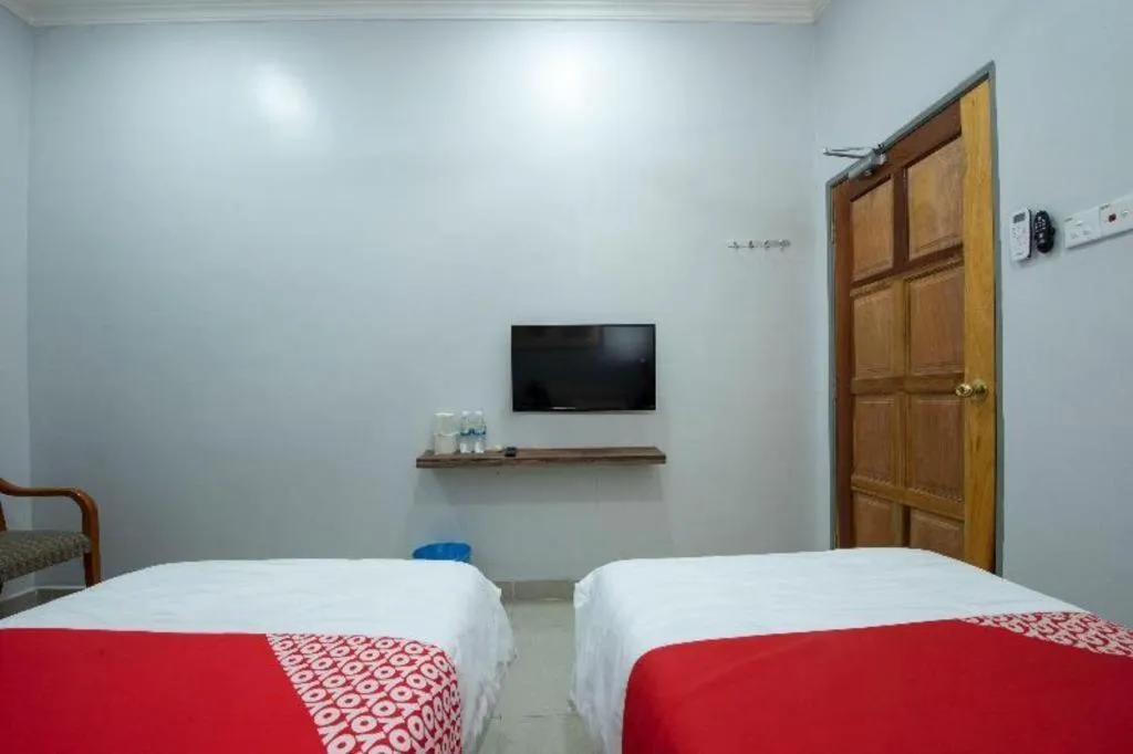 Bed in OYO 90234 Sungai Rengit City Resort 2