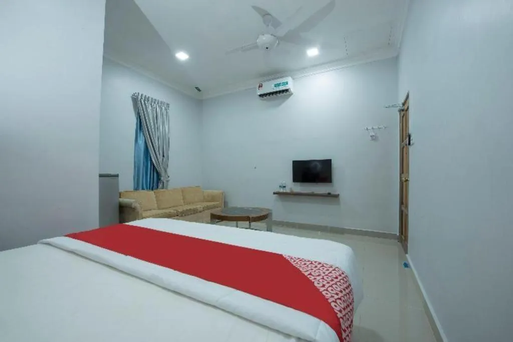 Bed in OYO 90234 Sungai Rengit City Resort 2