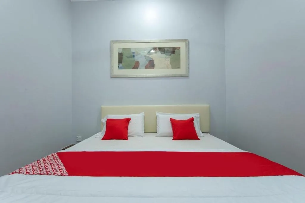 Bed in OYO 90234 Sungai Rengit City Resort 2