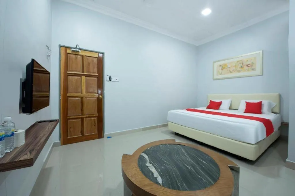 Bed in OYO 90234 Sungai Rengit City Resort 2