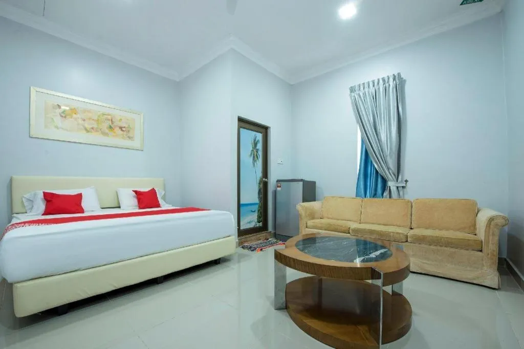 Bed in OYO 90234 Sungai Rengit City Resort 2