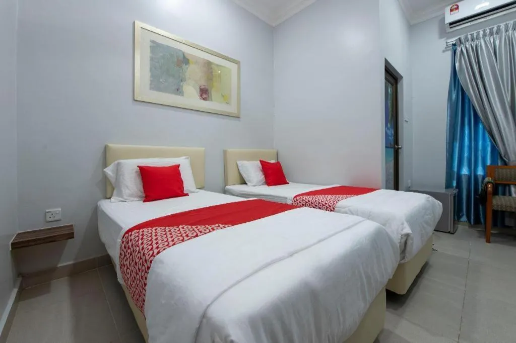 Bed in OYO 90234 Sungai Rengit City Resort 2