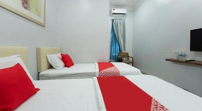 Bed in OYO 90234 Sungai Rengit City Resort 2