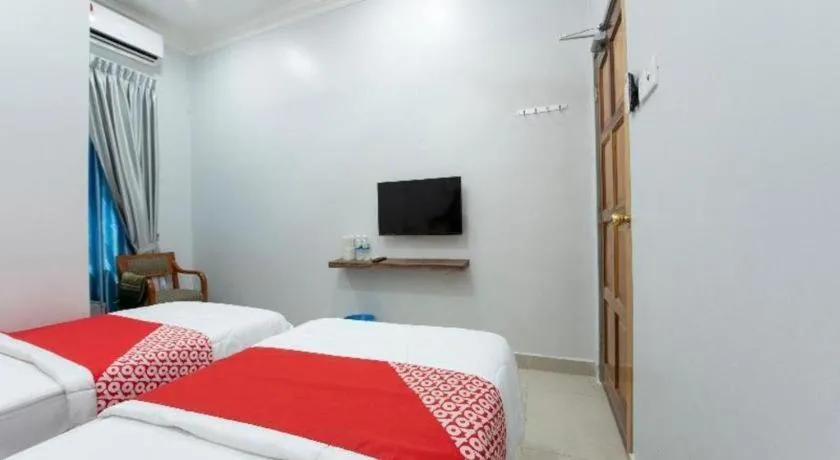 Bed in OYO 90234 Sungai Rengit City Resort 2