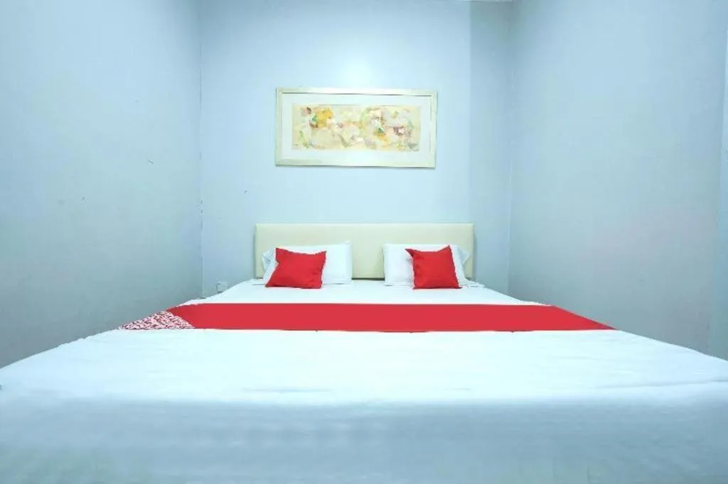 Bed in OYO 90234 Sungai Rengit City Resort 2