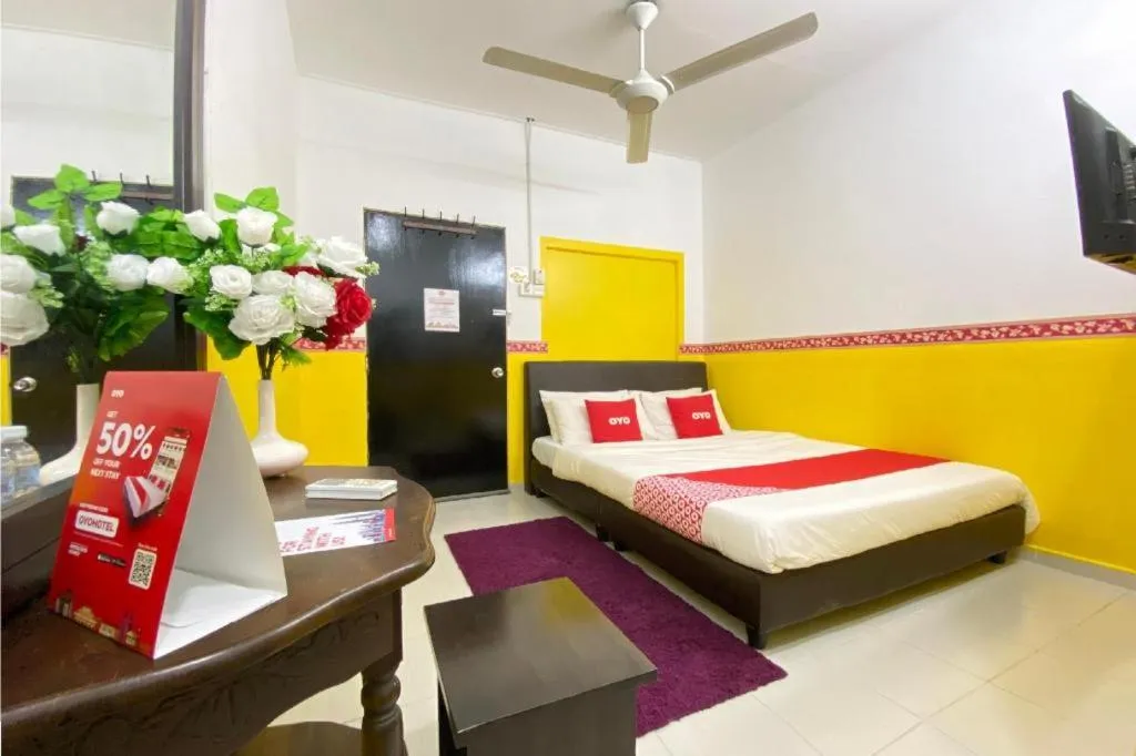 Bed in OYO 90176 D'cruz Sunrise Villa