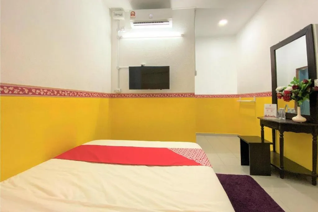 Bed in OYO 90176 D'cruz Sunrise Villa