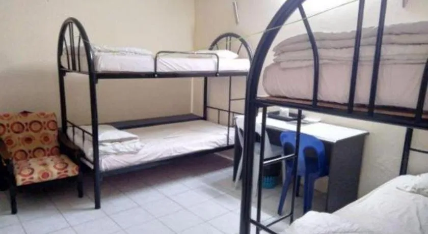 Bed in OYO 90376 Centre Point Hotel