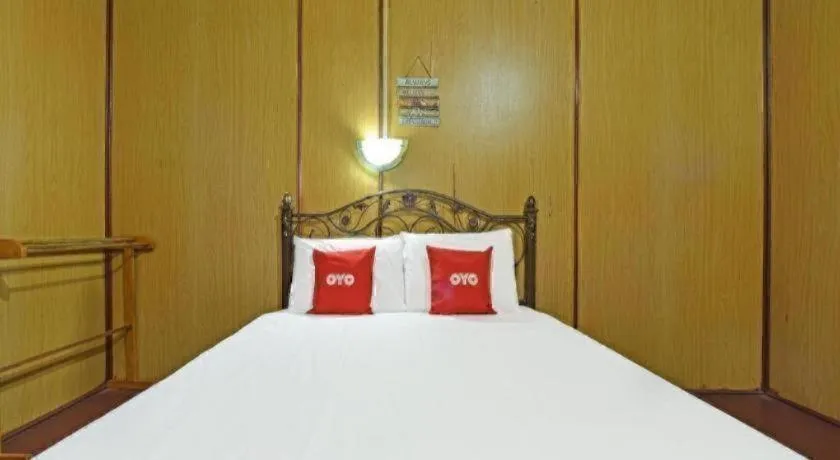 Bed in OYO 90620 Mahseer Chalet