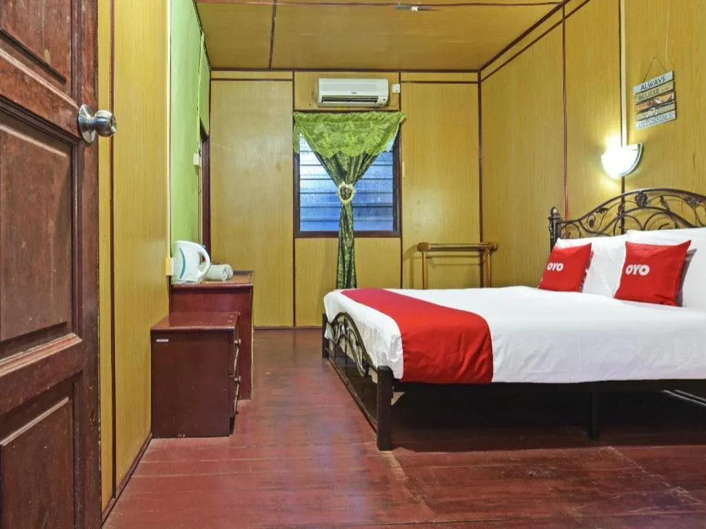 Bed in OYO 90620 Mahseer Chalet