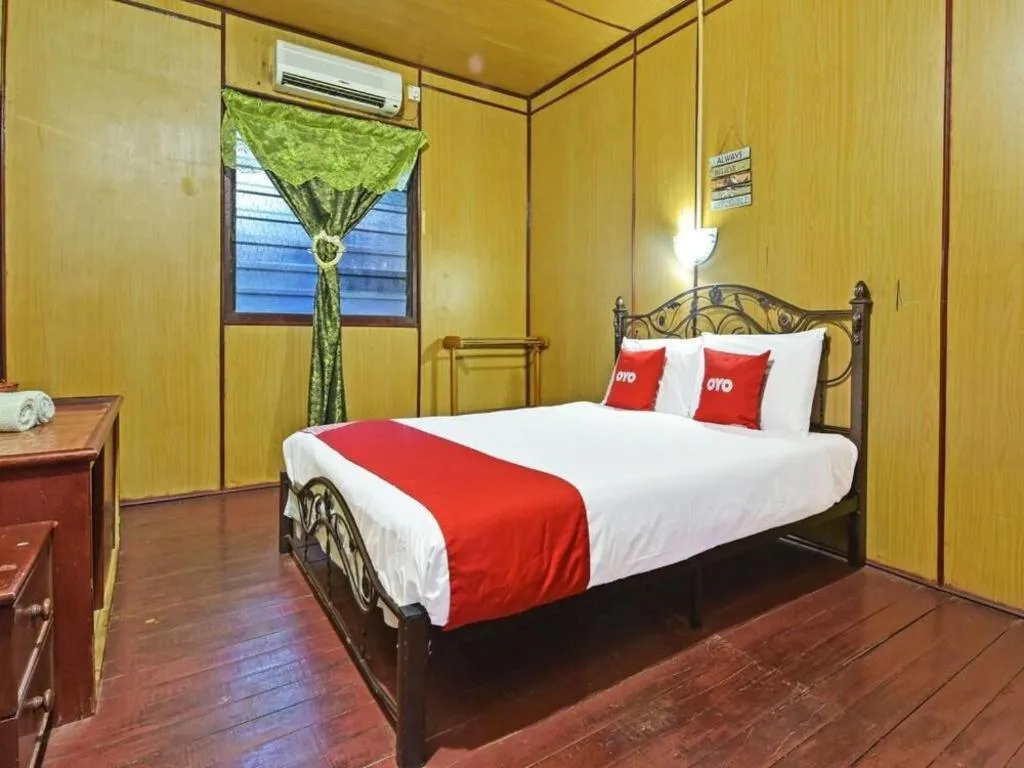Bed in OYO 90620 Mahseer Chalet