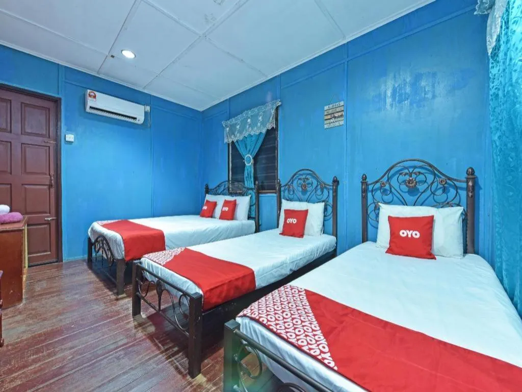 Bed in OYO 90620 Mahseer Chalet